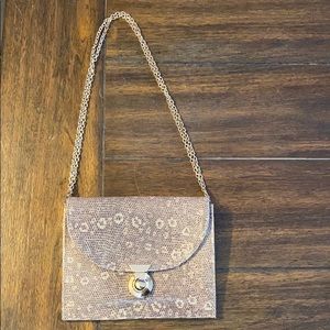 Lauren Merkin gold leather chain strap clutch.